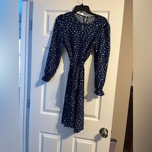 Long blue and white polkadot dress. Schoolteacher vibe.